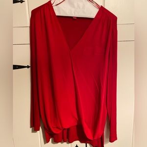 Vibrant candy apple red Vince Camuto drape and blouson style deep V-neck top. L.